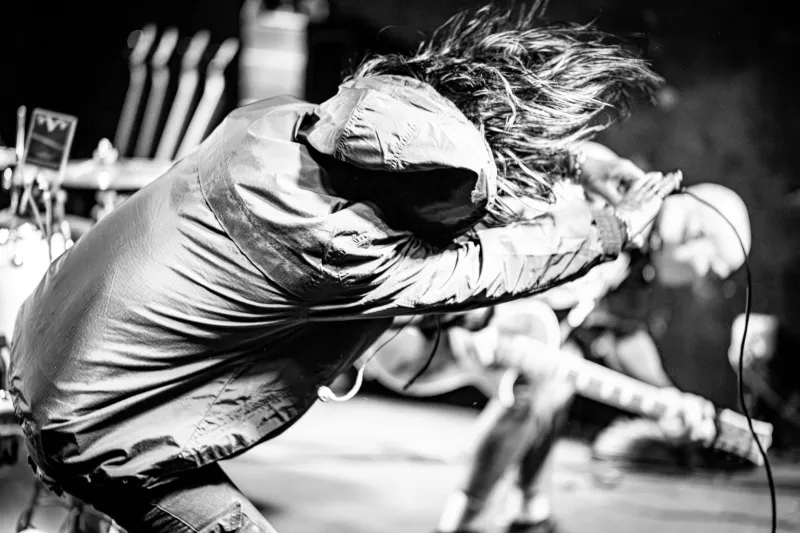 Chaos on Command: How Rock's Most Dangerous Frontmen Turned Unpredictability Into a Superpower